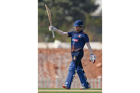 Delhi's Priyansh Arya celebrates his half century during the Vijay Hazare Trophy 2025-26 cricket match between Andhra and Delhi, at BCCI Centre of Excellence Ground, in Bengaluru.