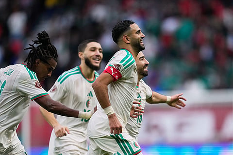 Algeria's Riyad Mahrez celebrates after scoring his side's second goal during the Africa Cup of Nations group E soccer match between Algeria and Sudan in Rabat, Morocco.