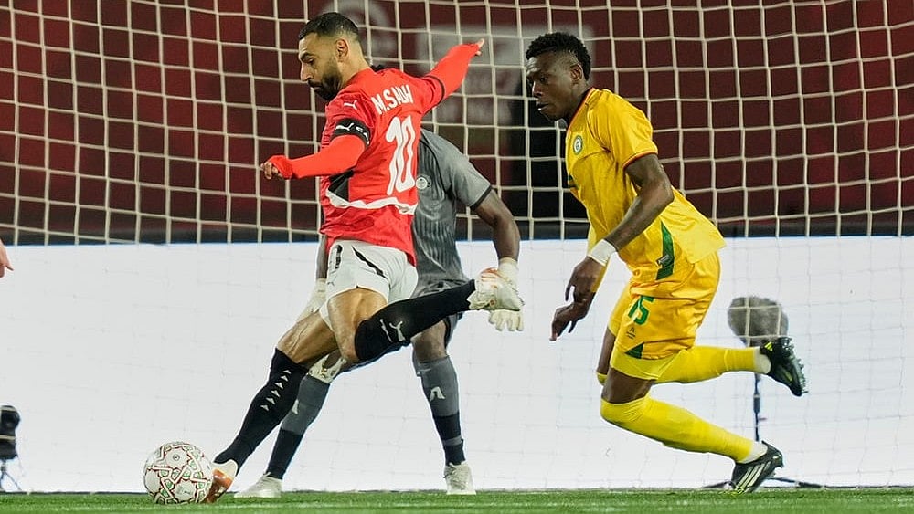 | Photo: AP/Mosa'ab Elshamy : Egypt's Mohamed Salah shoots during the Africa Cup of Nations group B soccer match between Egypt and Zimbabwe in Agadir, Morocco.