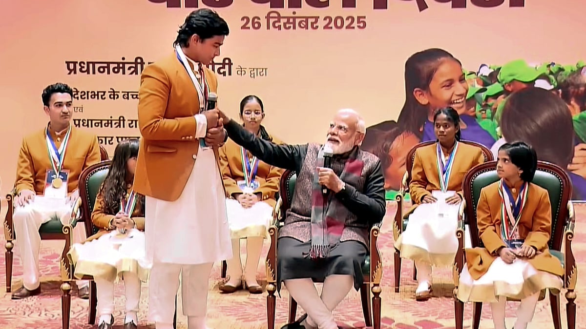 NarendraModi/YT via PTI Photo : Prime Minister Narendra Modi interacts with cricketer Vaibhav Suryavanshi during a meeting with the recipients of 'Pradhan Mantri Rashtriya Bal Puraskar' in New Delhi.