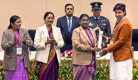 President Droupadi Murmu confers the 'Pradhan Mantri Rashtriya Bal Puraskar' on cricketer Vaibhav Suryavanshi during a ceremony on the occasion of 'Veer Bal Diwas', in New Delhi. 