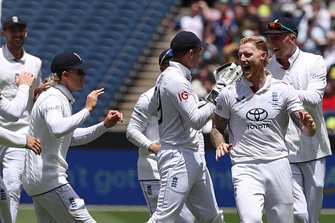 England's Ben Stokes, second right, celebrates with teammates after dismissing Australia's Alex Carey during their Ashes cricket test match in Melbourne.
