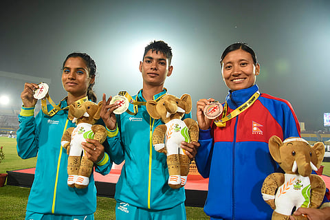 Gold medallist India's Sanjana Singh, silver medallist India's Seema and bronze medallist Nepal's Santoshi Shrestha during the felicitation ceremony after the Women's 5000 meter run at the 4th South Asian (SAAF) Senior Athletics Championships, in Ranchi, Friday, Oct. 24, 2025. 