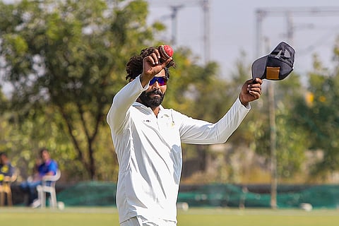 Saurashtra’s Ravindra Jadeja celebrates after taking seven wickets at the end of Delhi’s second innings on the second day of a Ranji trophy cricket match between Delhi and Saurashtra, at the Niranjan Shah Stadium, in Rajkot, Friday, Jan. 24, 2025. 