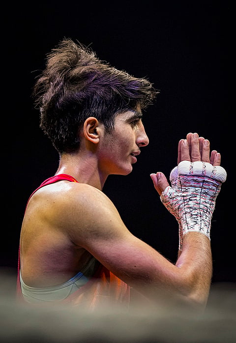 India's Minakshi Hooda after being declared the winner in the women's 48kg final match against Uzbekistan's Farzona Fozilova at the World Boxing Cup Finals 2025, in Greater Noida, Uttar Pradesh, Thursday, Nov. 20, 2025. 