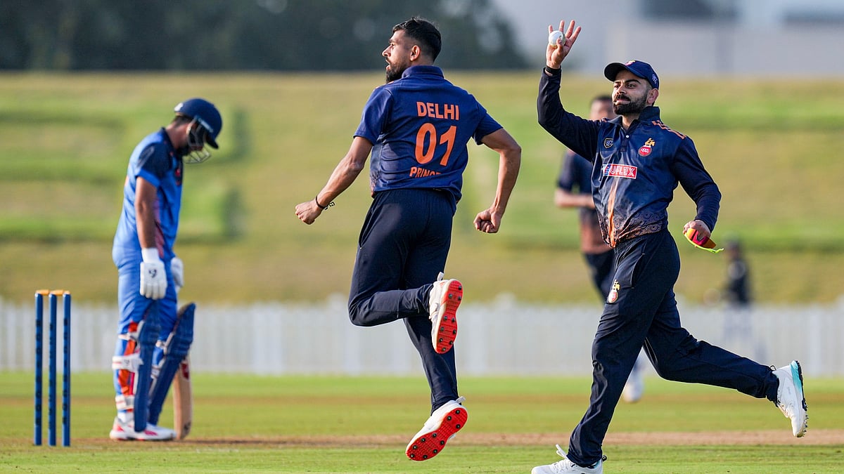 Photo: PTI : Virat Kohli, right, and Prince Yadav celebrate after Delhi won the Vijay Hazare Trophy 2025-26 match against Gujarat at BCCI Centre of Excellence in Bengaluru.
