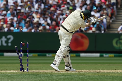 Australia's Steve Smith is bowled by England's Josh Tongue during their Ashes cricket test match in Melbourne.