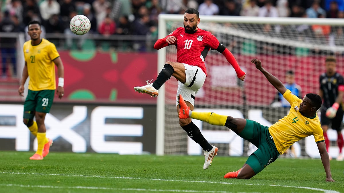 | Photo: AP/Themba Hadebe : Egypt's Mohamed Salah is challenged by South Africa's Teboho Mokoena during the Africa Cup of Nations group B soccer match between Egypt and South Africa in Agadir, Morocco, Friday, Dec. 26, 2025.