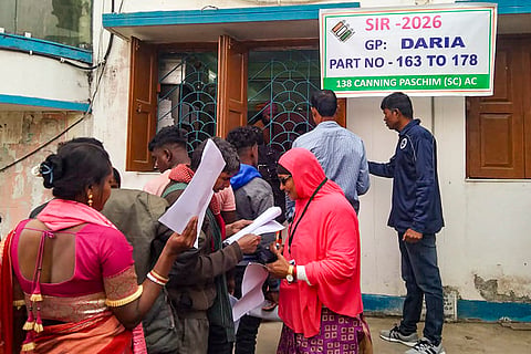 People wait in a queue for hearings under the Special Intensive Revision (SIR) of the electoral rolls, in South 24 Parganas district, West Bengal.