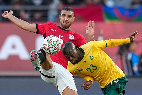 South Africa's Evidence Makgopa, right, and Egypt's Ramy Rabiaa compete for the ball during the Africa Cup of Nations group B soccer match between Egypt and South Africa in Agadir, Morocco.