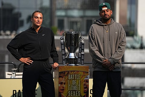 Tennis players Aryna Sabalenka of Belarus, left, and Nick Kyrgios of Australia pose with the trophy during a press conference ahead of the Battle of the Sexes exhibition match at Atlantis The Royal in Dubai, United Arab Emirates.
