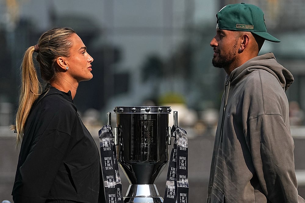 | Photo: AP/Fatima Shbair : Tennis players Aryna Sabalenka of Belarus, left, and Nick Kyrgios of Australia face-off with the trophy during a press conference ahead of the Battle of the Sexes exhibition match at Atlantis The Royal in Dubai, United Arab Emirates.
