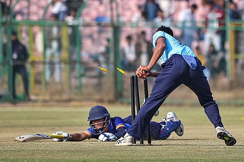 Mumbai Onkar Tarmale dislodges the bails to run out Uttarakhand’s Aarav Mahajan during a Vijay Hazare Trophy 2025-26 cricket match between Mumbai and Uttarakhand, at Sawai Mansingh Stadium, in Jaipur, Rajasthan.