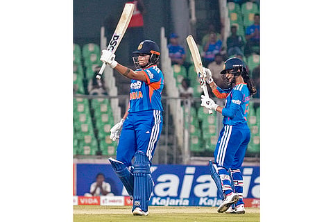 India's Shafali Verma, left, celebrates her-half century with teammate Jemimah Rodrigues, right, during the third T20 International cricket match of a series between India Women and Sri Lanka Women, at Greenfield International Stadium, in Thiruvananthapuram, Kerala.