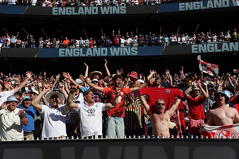 Fans celebrate England's win over Australia on Day 2 of their Ashes cricket test match in Melbourne.