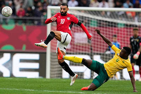 Egypt's Mohamed Salah is challenged by South Africa's Teboho Mokoena during the Africa Cup of Nations group B soccer match between Egypt and South Africa in Agadir, Morocco.