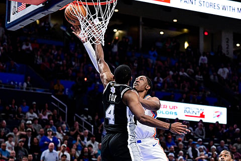 Oklahoma City Thunder guard/forward Jalen Williams (8) shoots against San Antonio Spurs guard De'Aaron Fox (4) during the second half of an NBA basketball game in Oklahoma City. 