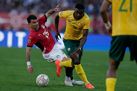 South Africa's Teboho Mokoena is challenged by Egypt's Ahmed Zizo during the Africa Cup of Nations group B soccer match between Egypt and South Africa in Agadir, Morocco.