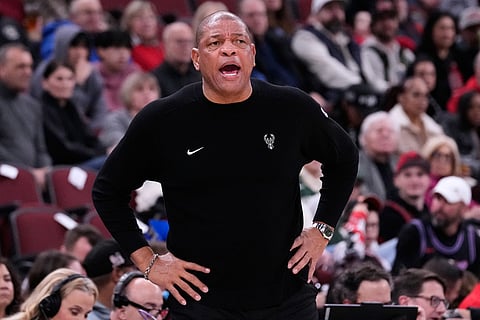 Milwaukee Bucks head coach Doc Rivers calls his team during the first half of an NBA basketball game against the Chicago Bulls in Chicago.