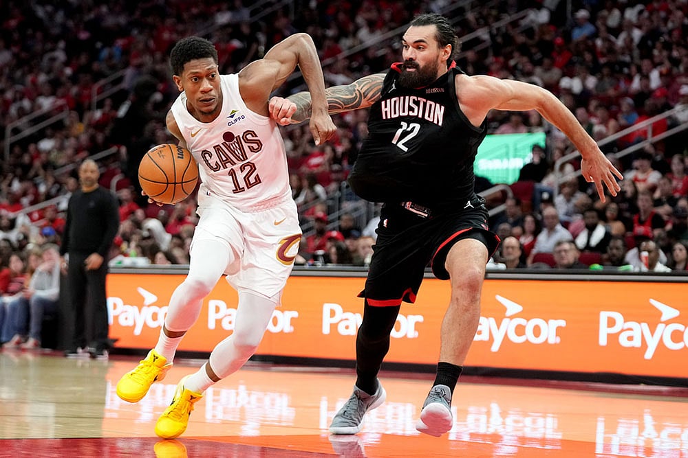 | Photo: AP/Eric Christian Smith : Cleveland Cavaliers forward De'Andre Hunter, left, drives to the basket as Houston Rockets center Steven Adams, right, defends during the second half of an NBA basketball game in Houston.