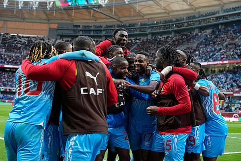 DR Congo team celebrate after scoring a goal during the Africa Cup of Nations group D soccer match between Senegal and DR Congo in Tangier, Morocco.