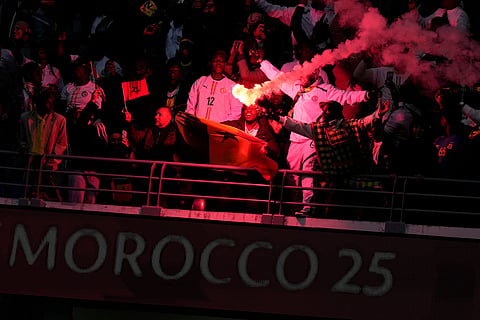 Senegal fans celebrate after scoring a goal during the Africa Cup of Nations group D soccer match between Senegal and DR Congo in Tangier, Morocco.