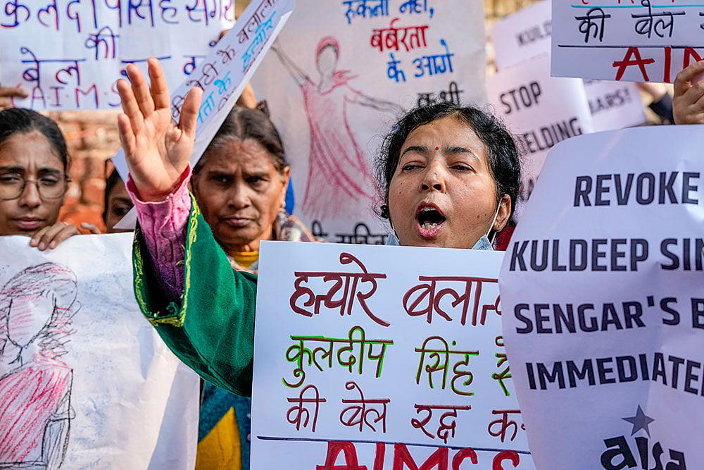 | Photo: PTI/Atul Yadav : Members of various organisations raise slogans during a protest seeking justice for the Unnao rape case survivor, at Jantar Mantar in New Delhi.