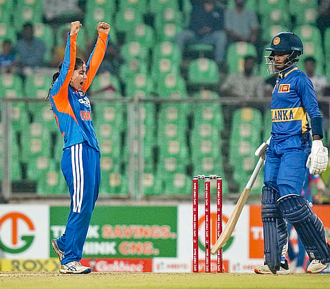 India's Vaishnavi Sharma, left, celebrates a wicket during the fourth T20 International cricket match of a series between India Women and Sri Lanka Women, at Greenfield International Stadium, in Thiruvananthapuram, Kerala.