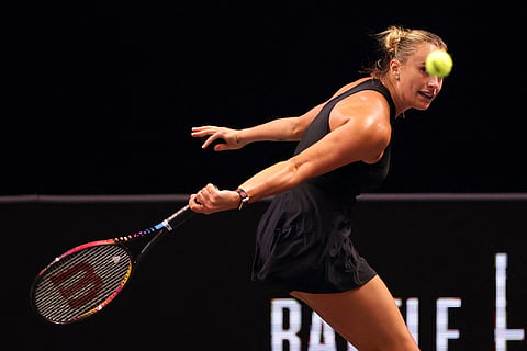 Aryna Sabalenka plays a backhand against Nick Kyrgios during their Battle of the Sexes tennis match in Dubai, United Arab Emirates.