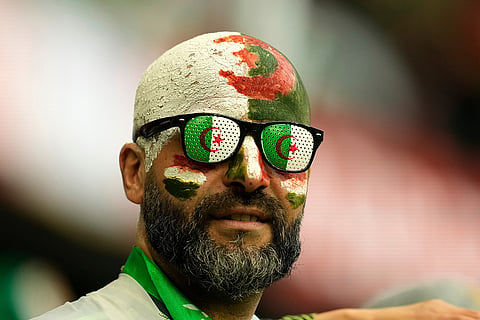 Algeria's fans wait for the start of the Africa Cup of Nations group E soccer match between Algeria and Burkina Faso in Fez, Morocco.