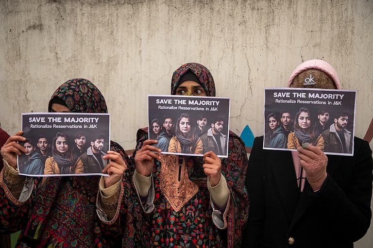 Kashmiri medical students hold placards as they take part in a protest led by the ruling National Conference leader and member of Indian Parliament Aga Syed Ruhullah Mehdi outside the chief minister s official residence in Srinagar, demanding fairness and rationality in Jammu and Kashmir s job reservation policy. Protesters allege that the reservation policy approved during the Central rule puts open merit students and job aspirants at a disadvantage as it reserves more than 60% of opportunities to reserved work placement categories. - IMAGO / ZUMA Press Wire