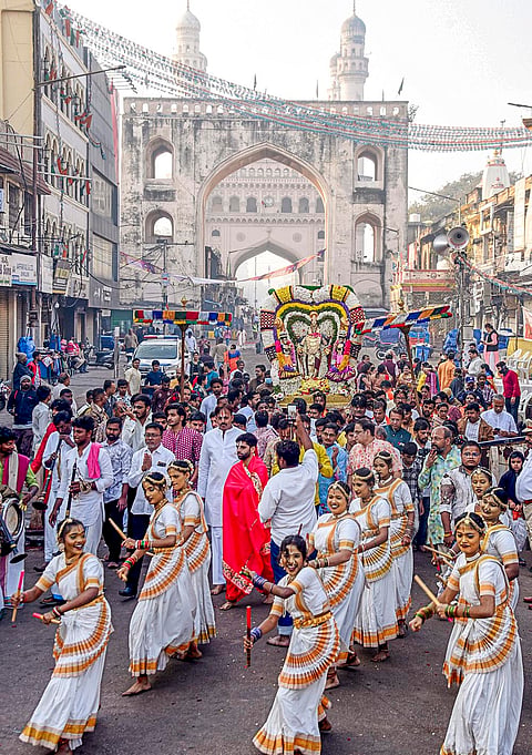 Devotees take part in a religious procession during the 'Vaikuntha Ekadashi' festival, at Padhmanabha Swamy Temple in Hyderabad.
