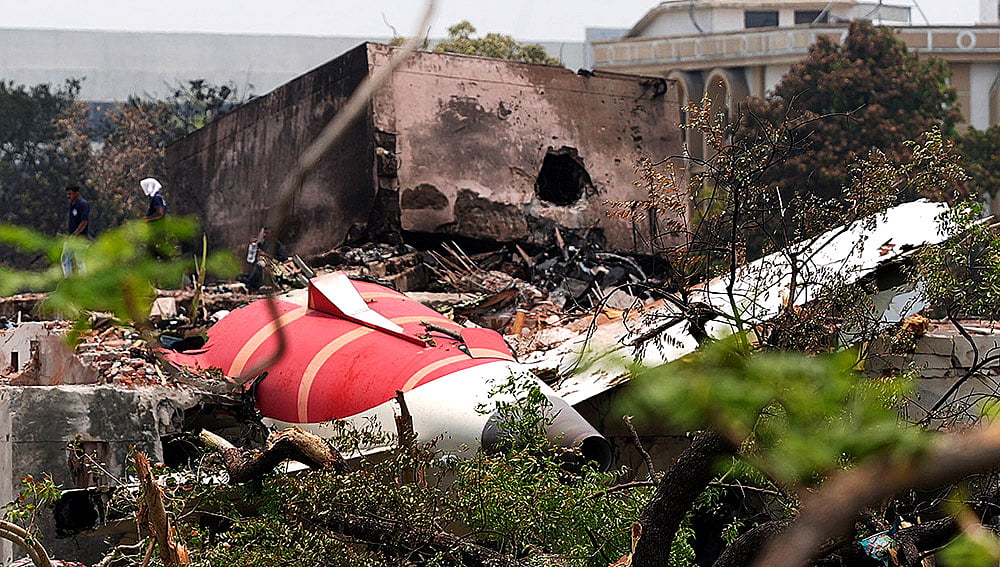 The wing of Air India flight 171 lies broken in the dust, just outside Meghnagar.  - Photo: Dinesh Parab/Outlook