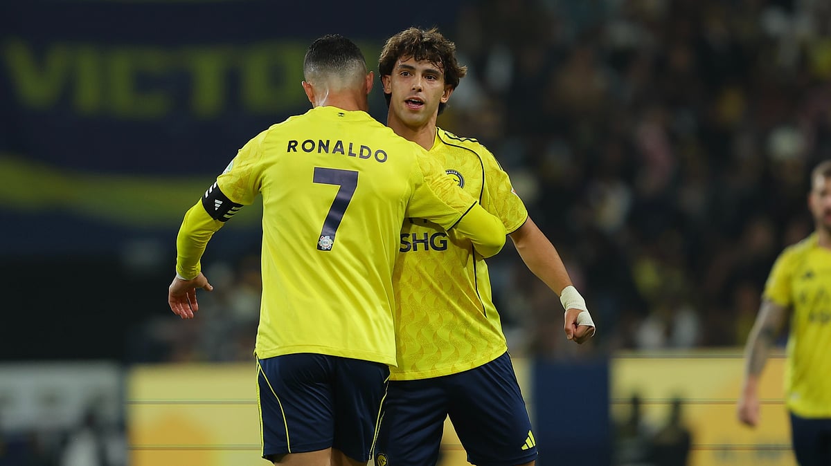 | Photo: X/AlNassrFC_EN : Al-Nassr's Cristiano Ronaldo celebrates with Joao Felix after a goal during the Saudi Pro League match against Al Akhdoud on December 27, 2025.