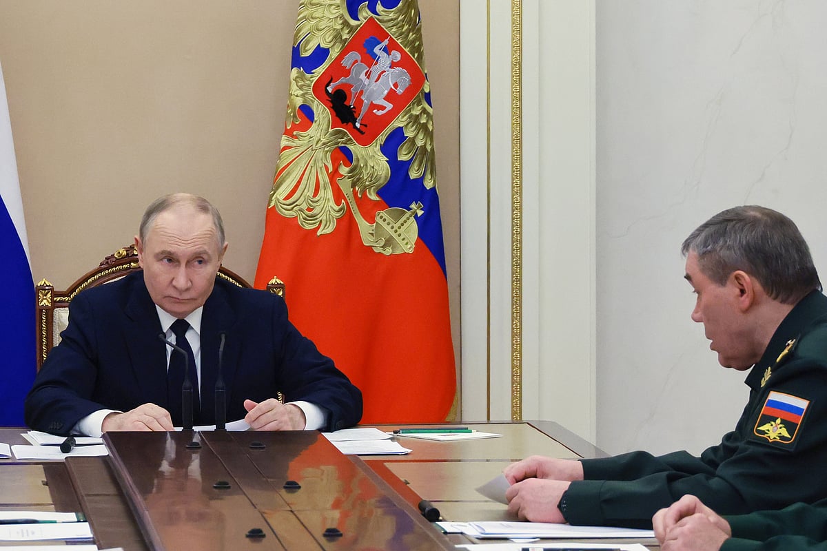 Mikhail Metzel/Sputnik, Kremlin Pool Photo via AP : Russian President Vladimir Putin, left, listens to Russian Chief of General Staff Gen. Valery Gerasimov during a meeting with senior military officers at the Kremlin in Moscow, Russia, Monday, Dec. 29, 2025. 