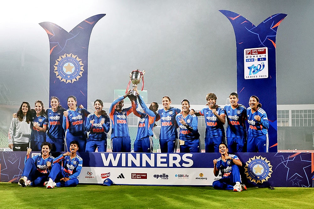| Photo: PTI : India's players celebrate with the trophy after winning the T20 International cricket match series against Sri Lanka at the Greenfield International Stadium in Thiruvananthapuram, Kerala. India Women won by 15 runs. 