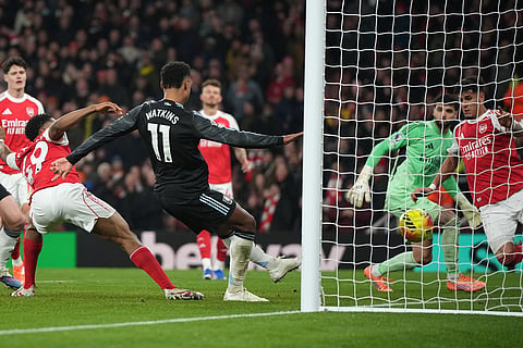 Aston Villa's Ollie Watkins, centre, scores his side's opening goal during the English Premier League soccer match between Arsenal and Aston Villa in London.