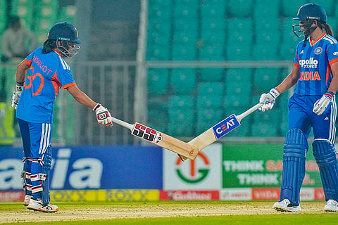 India's captain Harmanpreet Kaur, right, with teammate Amanjot Kaur during the fifth T20 International cricket match of a series between India Women and Sri Lanka Women, at Greenfield International Stadium, in Thiruvananthapuram.