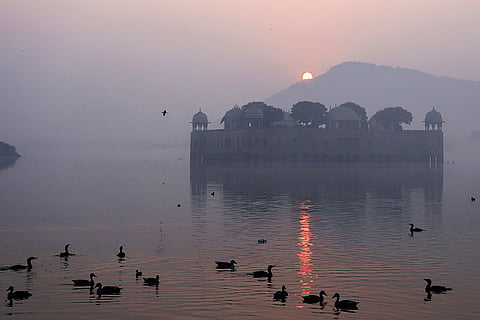 The sun rises on the last day of the year 2025, at Jal Mahal in Jaipur.