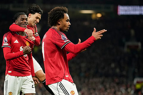 Manchester United's Joshua Zirkzee celebrates after he scored the opening goal during the English Premier League soccer match between Manchester United and Wolverhampton Wanderers in Manchester, England.