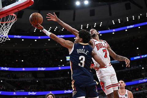 New Orleans Pelicans' Jordan Poole, (3) goes up for a shot against Chicago Bulls' Dalen Terry (7) during the first half of an NBA basketball game in Chicago.