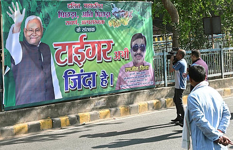 JDU supporters put posters reading Tiger Zinda Hai featuring Bihar CM Nitish Kumar outside of JDU office on the eve of vote counting for Bihar Assembly Elections 2025 on November 13, 2025 in Patna, India.