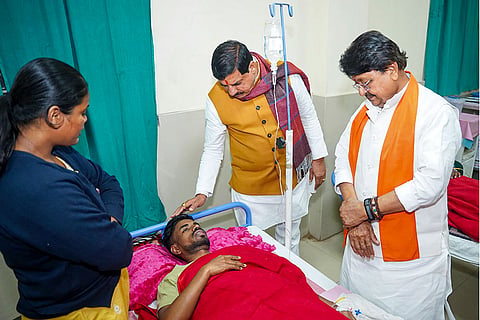 In this image posted on Dec. 31, 2025, Madhya Pradesh Chief Minister Mohan Yadav and Minister Kailash Vijayvargiya meet an affected person undergoing treatment after consumption of contaminated water, at a hospital in Indore.