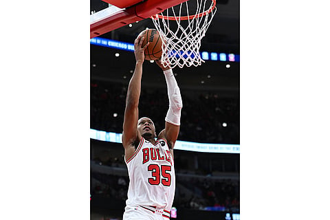 Chicago Bulls' Isaac Okoro goes up for a dunk during the second half of an NBA basketball game against the New Orleans Pelicans in Chicago.