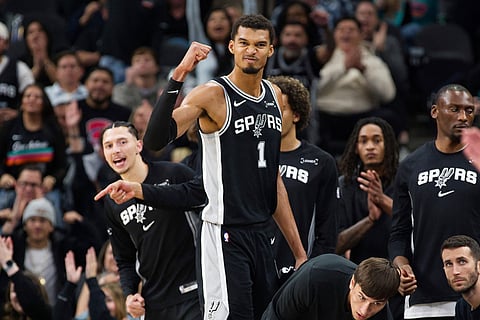 San Antonio Spurs center Victor Wembanyama (1) celebrates a basket during the second half of an NBA basketball game against the New York Knicks in San Antonio.