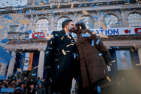 Mayor Zohran Mamdani, left, and his wife Rama Duwaji kiss during Mamdani's inauguration ceremony in New York. 