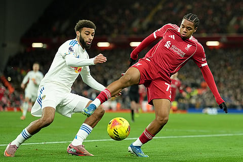 Liverpool's Rio Ngumoha, right, and Leeds' Jayden Bogle challenge for the ball during the English Premier League soccer match between Liverpool and Leeds United in Liverpool, England.
