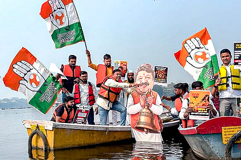 Youth Congress activists protest against Minister of Parliamentary Affairs of Madhya Pradesh Kailash Vijayvargiya over Indore water contamination deaths, at Lower Lake, in Bhopal.