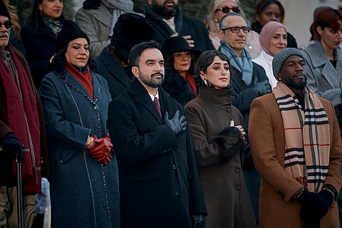 Mayor Zohran Mamdani, center left, and his wife, Rama Duwaji, center right, stand during the national anthem at Mamdani's inauguration ceremony in New York. 