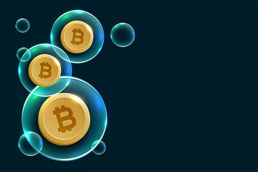 Bitcoin coins floating inside blue digital bubbles on a dark background